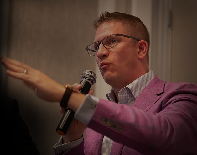 Thomas Donohoe speaking at an event.